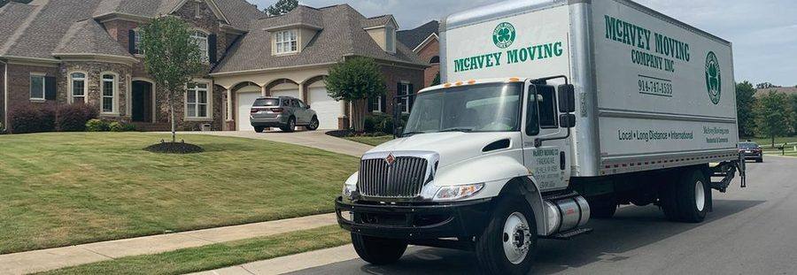 McAvey Moving Company truck outside a suburban Westchester home