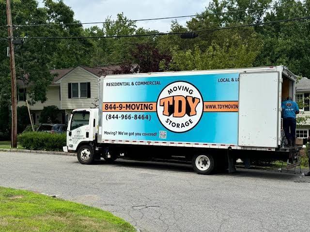 TDY Moving and Storage truck on a residential Westchester street