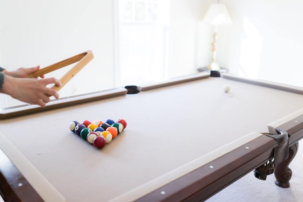 Person playing on a Pool Table