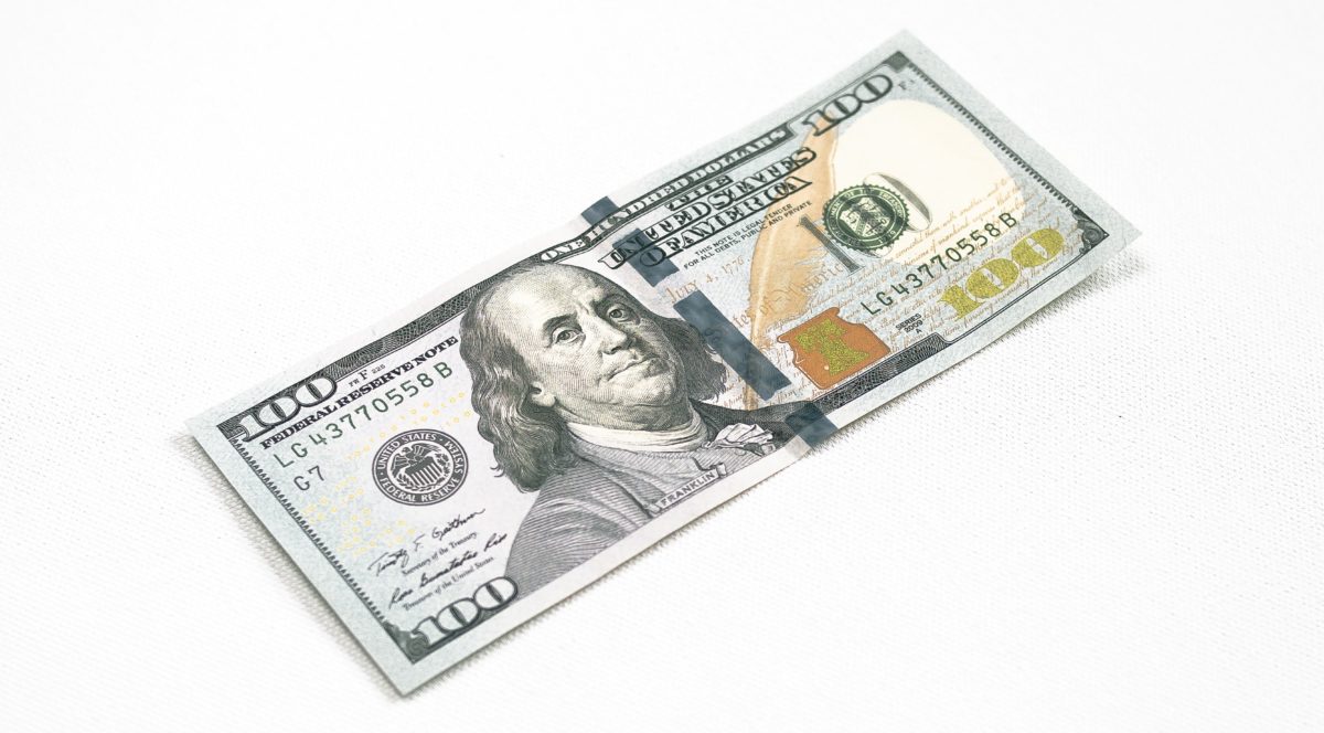 one hundread dollar bill on a white background