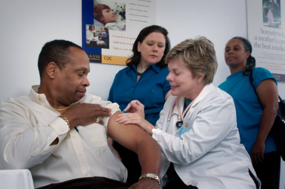 Doctor shooting a vaccine