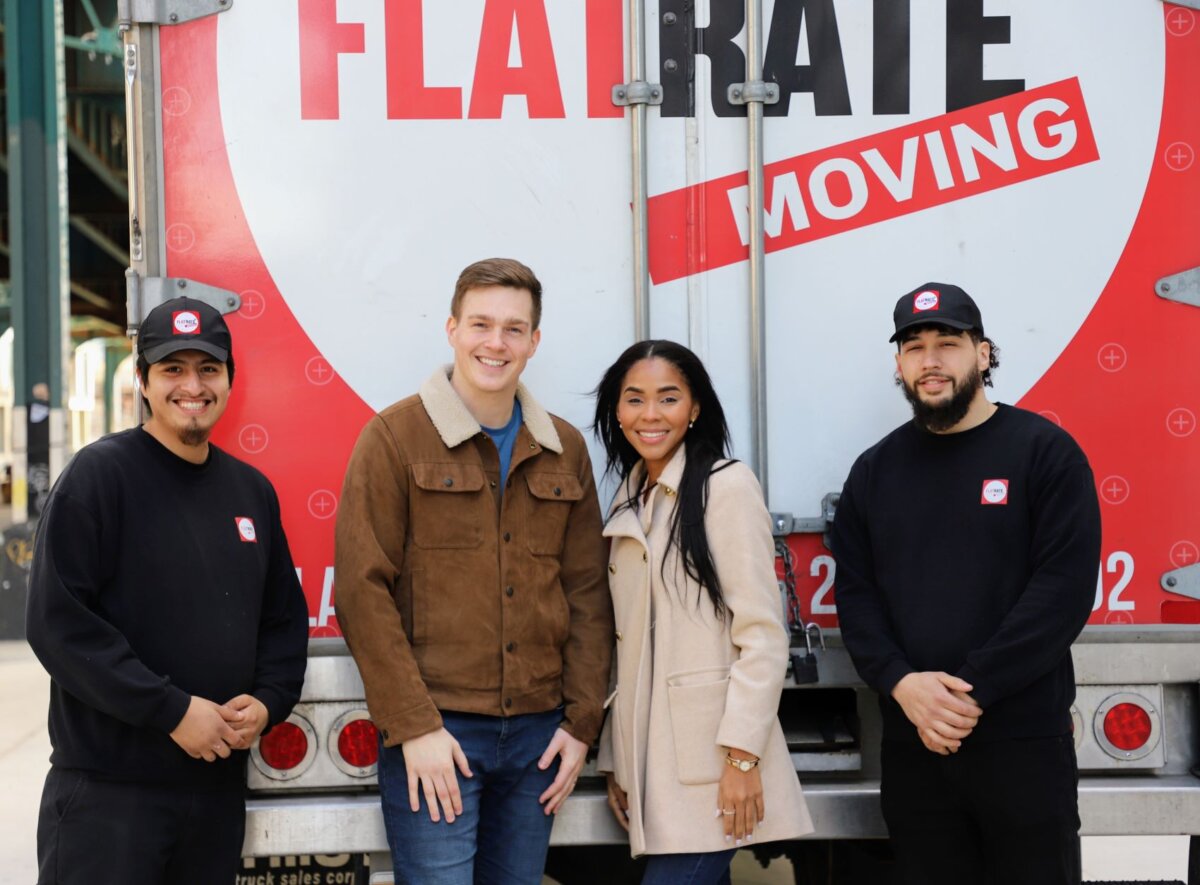 FlatRate Movers and customers in front of moving truck