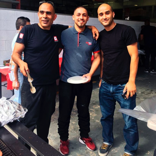 FlatRate movers pose for a picture at the FlatRate BBQ