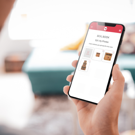 A person holds a phone on the FlatRate app