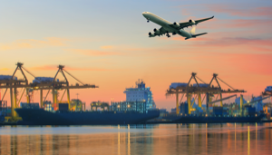 A plane flies above the water