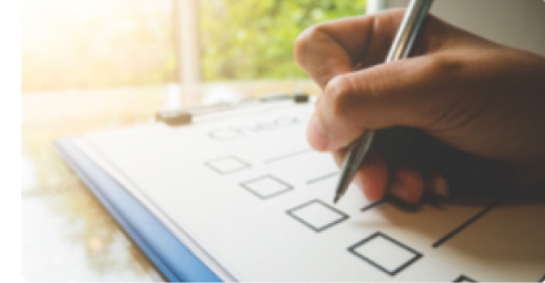 A person completes a checklist