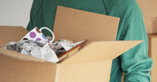 A person carries a box