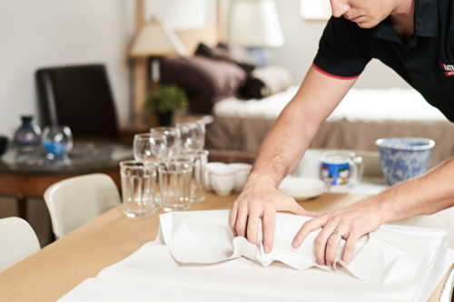 A mover wraps cutlery