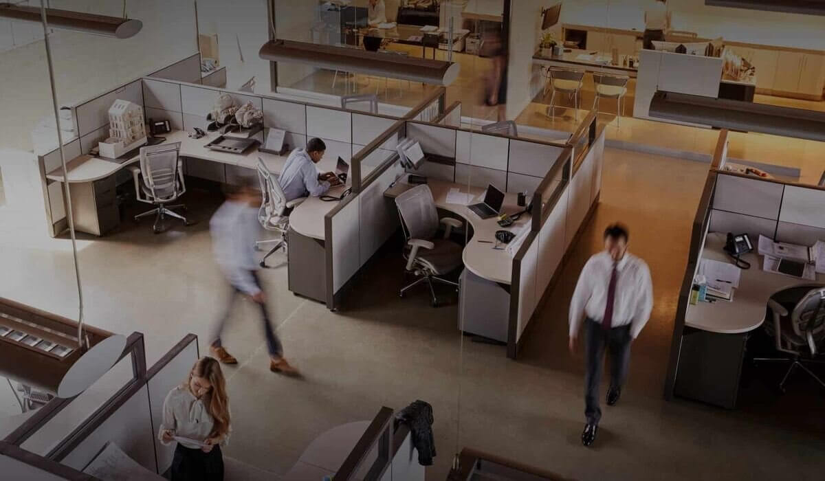 Office desk with people working