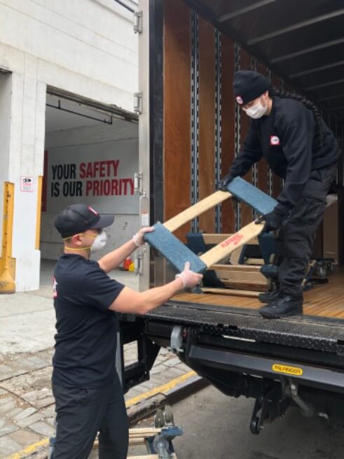 Movers working with masks