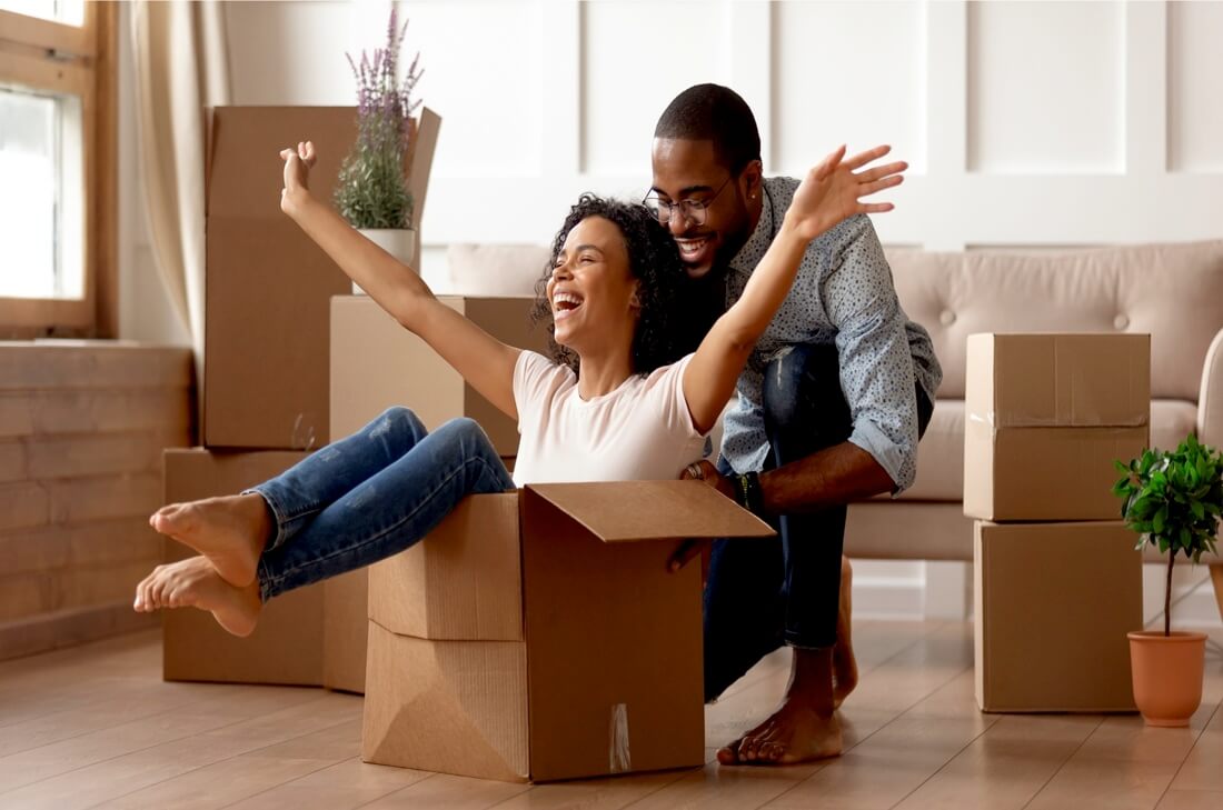 Man and woman playing with boxes