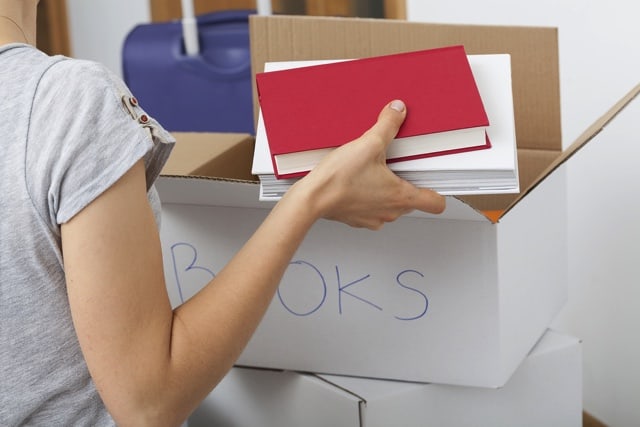 woman packing books