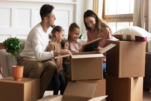 Family unpacking boxes