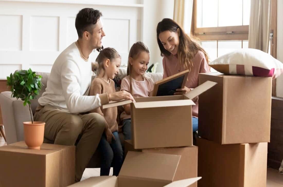 Family unpacking boxes