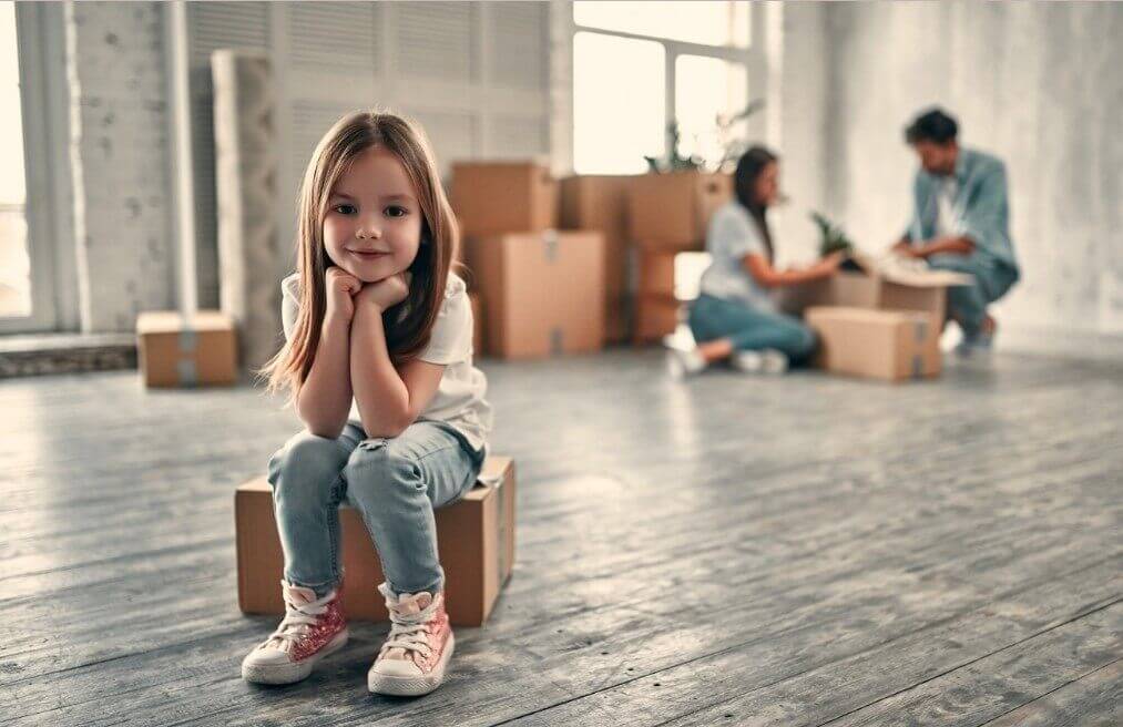 Young girl sitted on a box