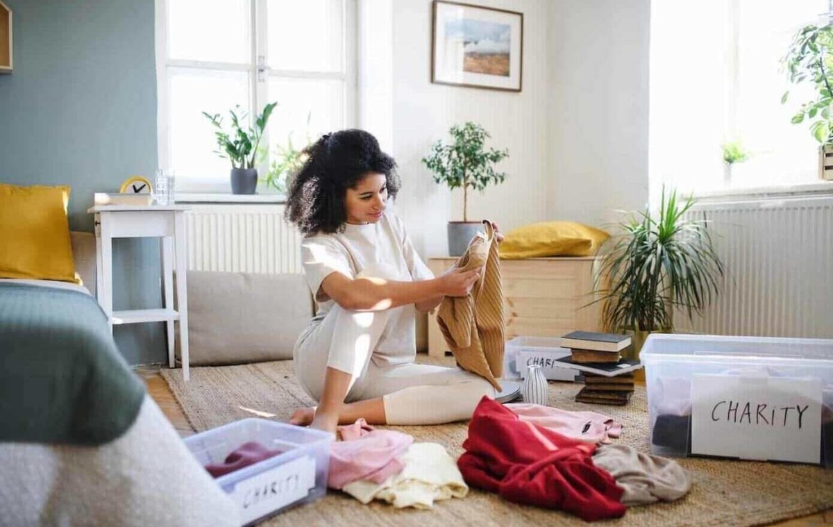 Woman choosing items for charity