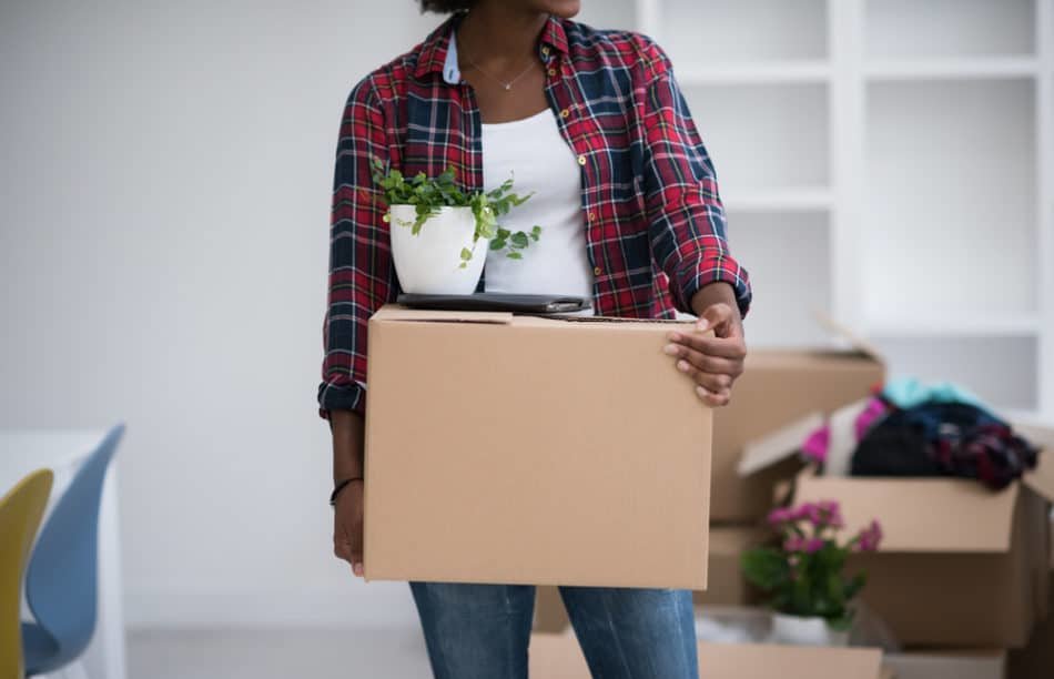 woman carrying one box closeup