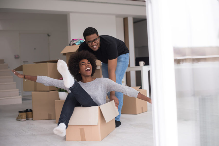 couple playing packing moving