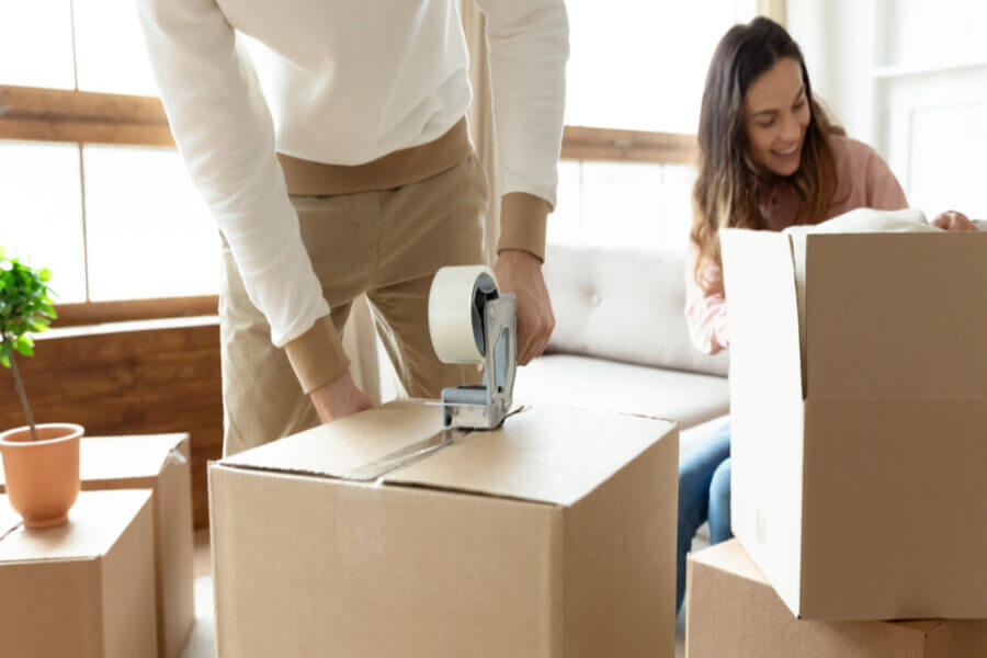 Man and woman placking with boxes