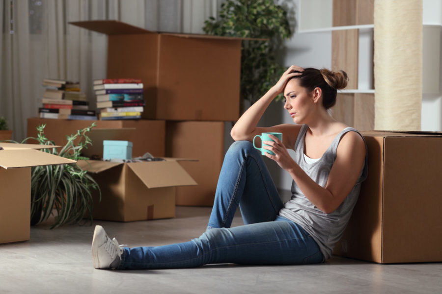 woman moving boxes anxiety stress