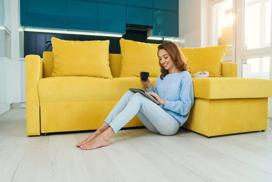 woman on floor with ipad