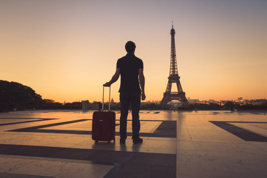 man with suitcase paris