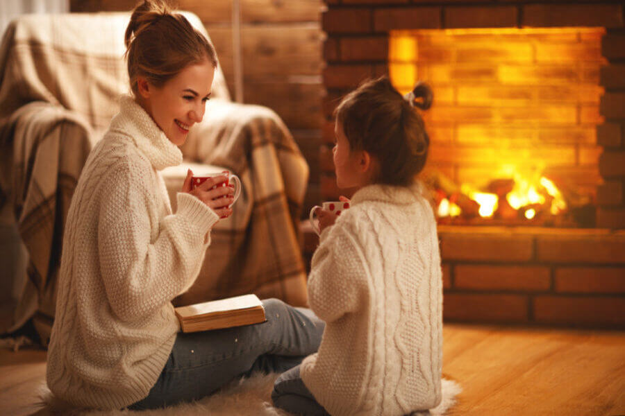 Mom and daughter drinking hot cocoa