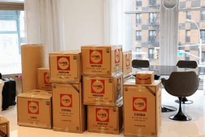 FlatRate Moving boxes packed in NYC apartment The Key Difference Between a Commercial and a Residential Move