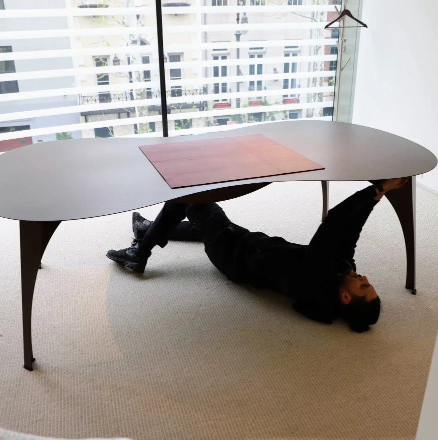 Mover working below a table, installing it