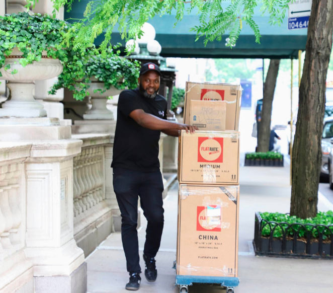 mover moving a stack of boxes