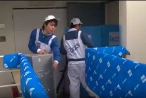 Japanese movers protecting the building hall