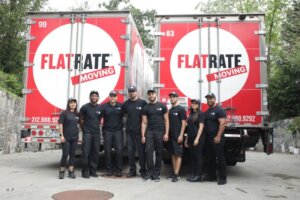 FlatRate movers posing in front of moving trucks 300x200 The Hidden Costs of Moving: What Some Moving Companies Charge