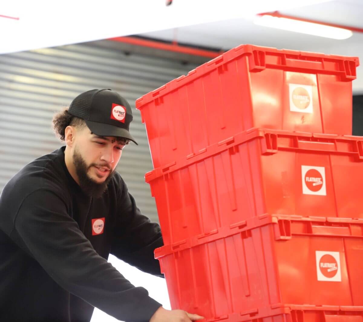 Flatrate mover pushing red bins