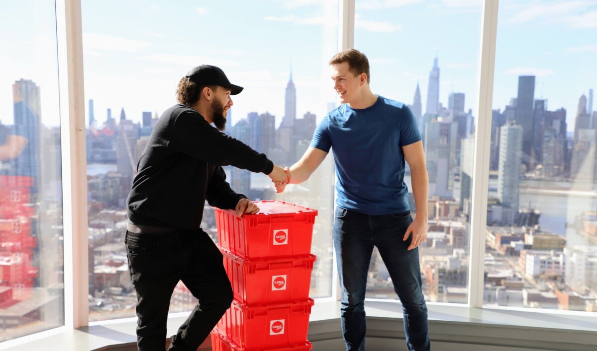 FlatRate movers shaking hands with a client