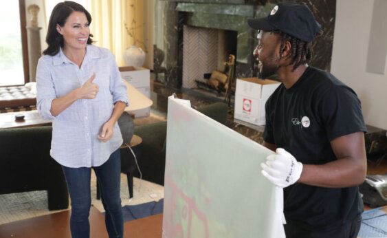 FlatRate Mover and client talking FlatRate Moving Client