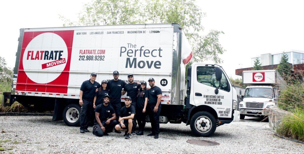 FlatRate Movers in front of FlatRate Moving truck