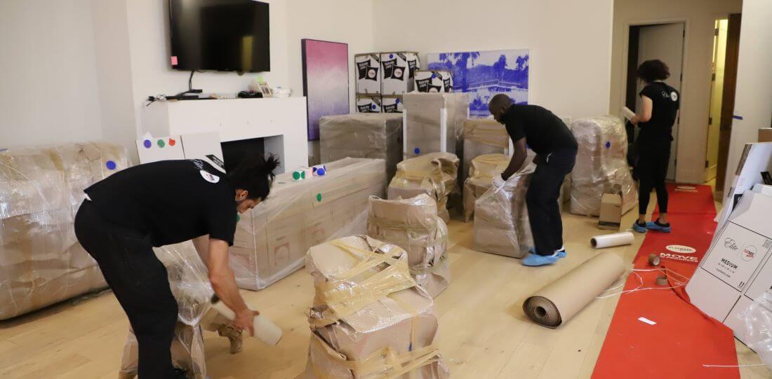 NYC Moving Team Wrapping Furniture