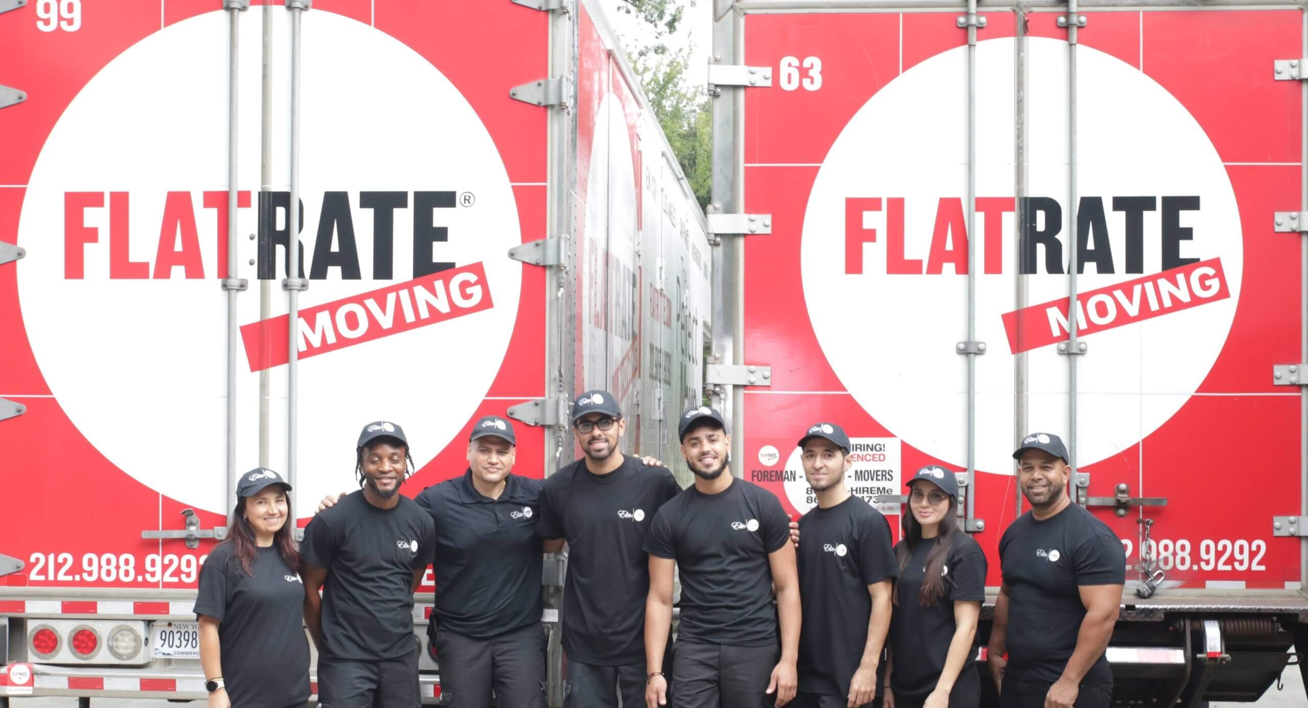 FlatRate Movers in front of a moving truck scaled Navigating the Challenges of Moving: Protecting Yourself Against Scams