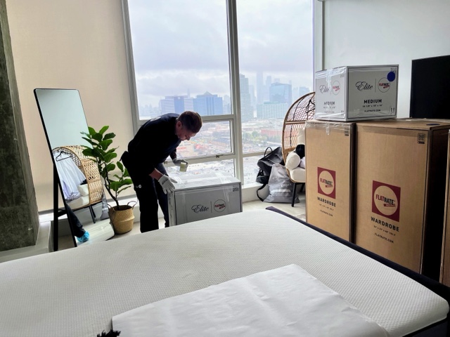 FlatRate mover packing a box