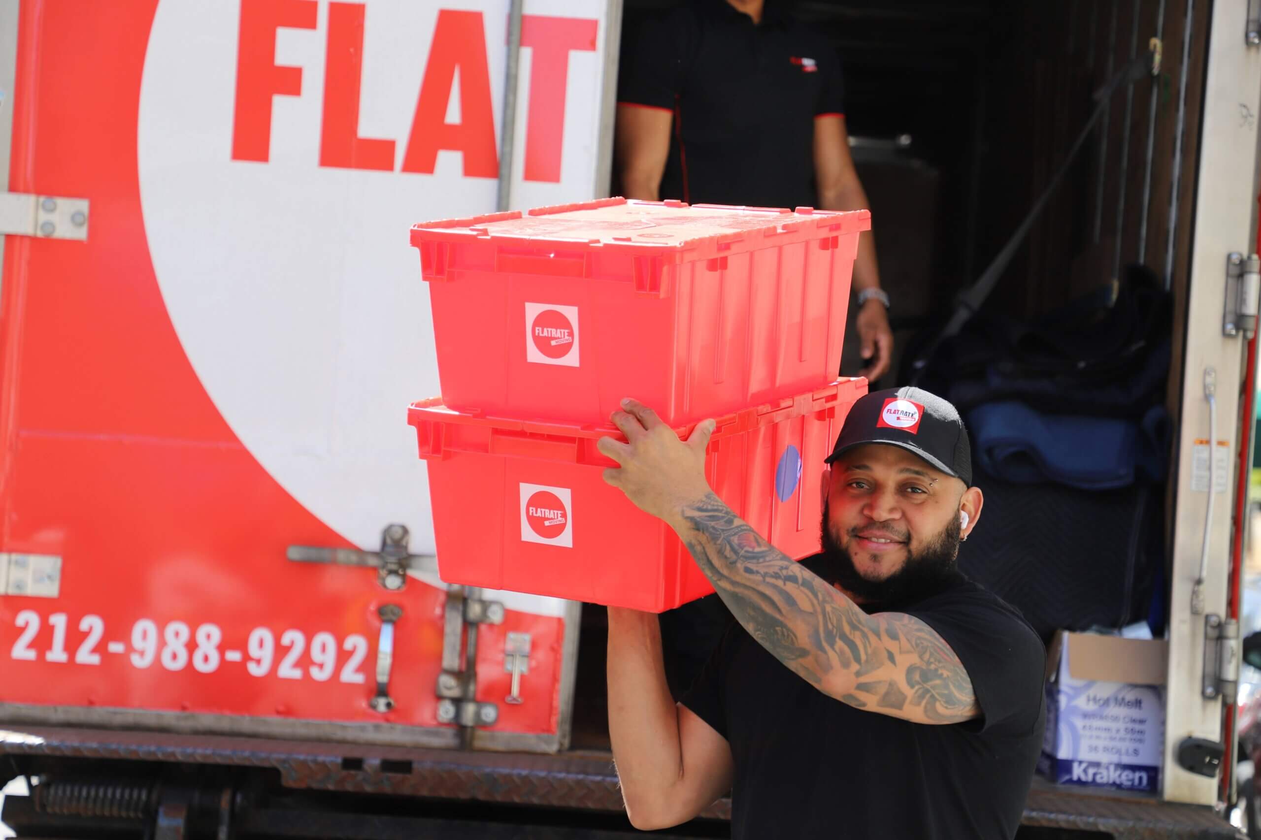 Mover moving two red plastic boxes