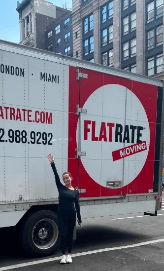 woman step near a Flatrate truck
