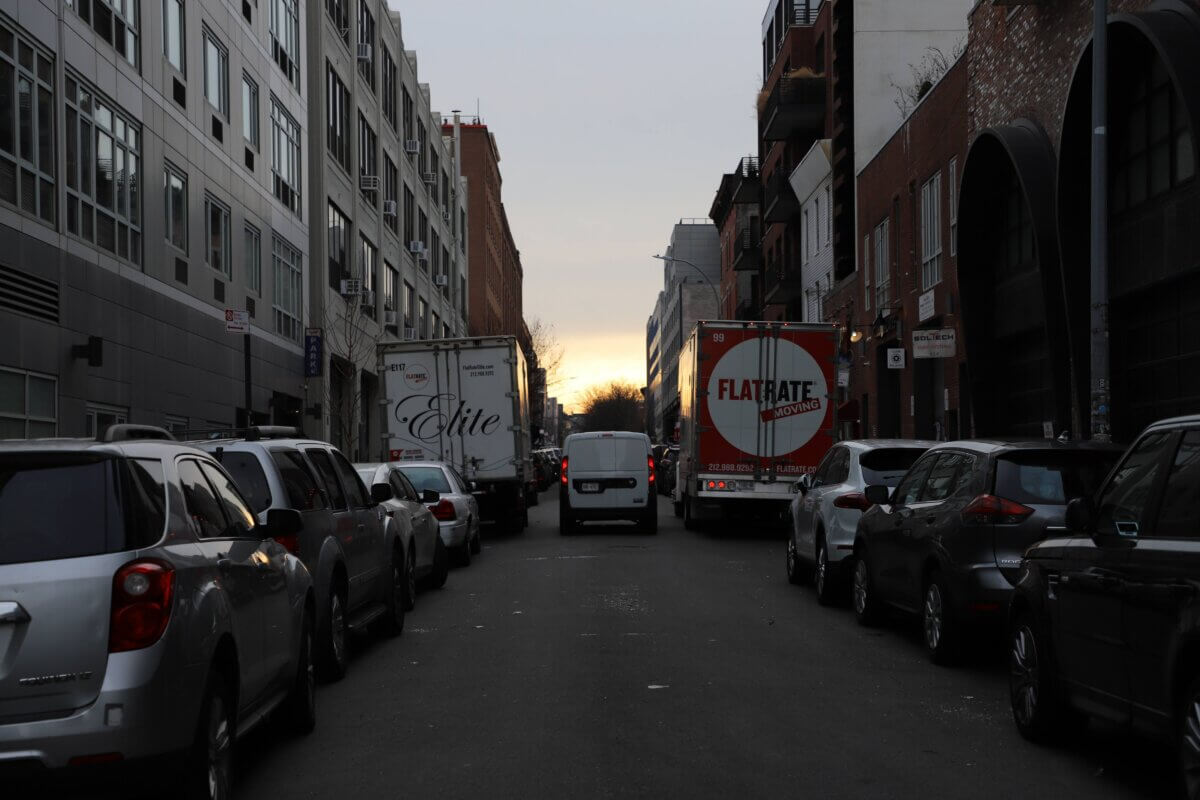 image of moving trucks at sunset