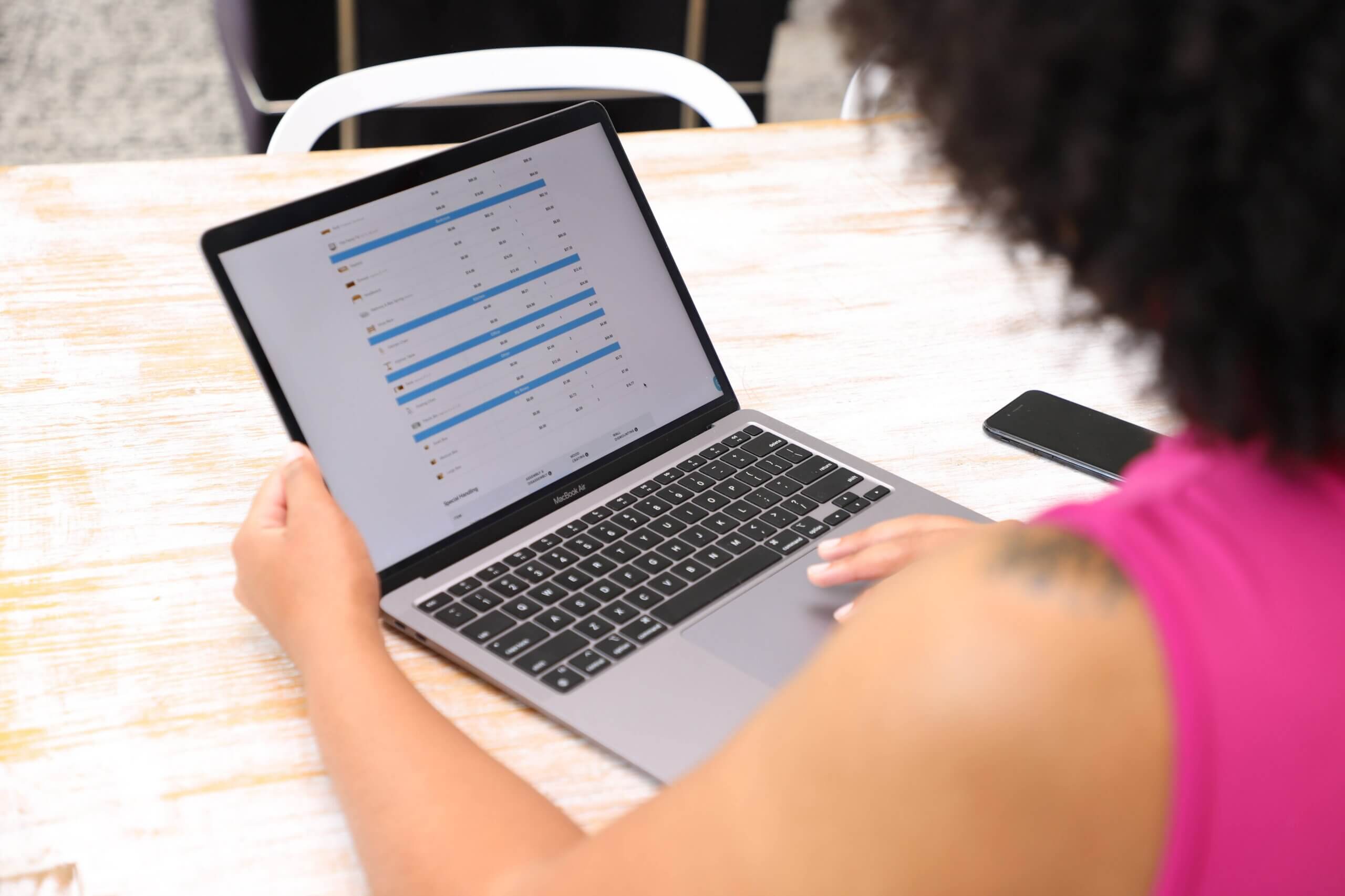 person reviewing laptop